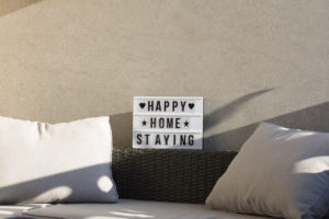 At home on the balcony, sign 'happy home staying' At home on the balcony, sign 'happy home staying'